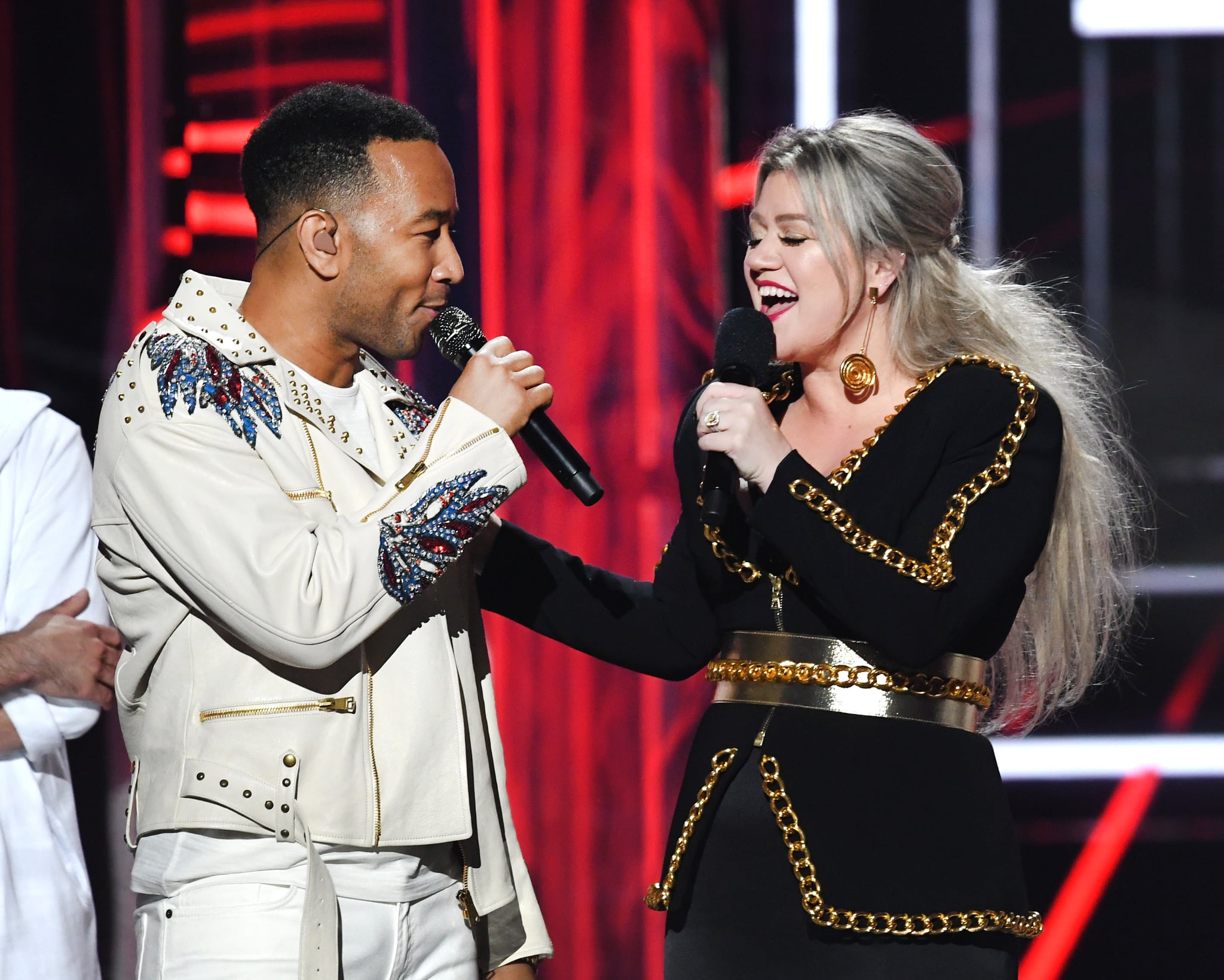 LAS VEGAS, NV - MAY 20:  Recording artist John Legend (L) and host Kelly Clarkson speak onstage during the 2018 Billboard Music Awards at MGM Grand Garden Arena on May 20, 2018 in Las Vegas, Nevada.  (Photo by Kevin Winter/Getty Images)