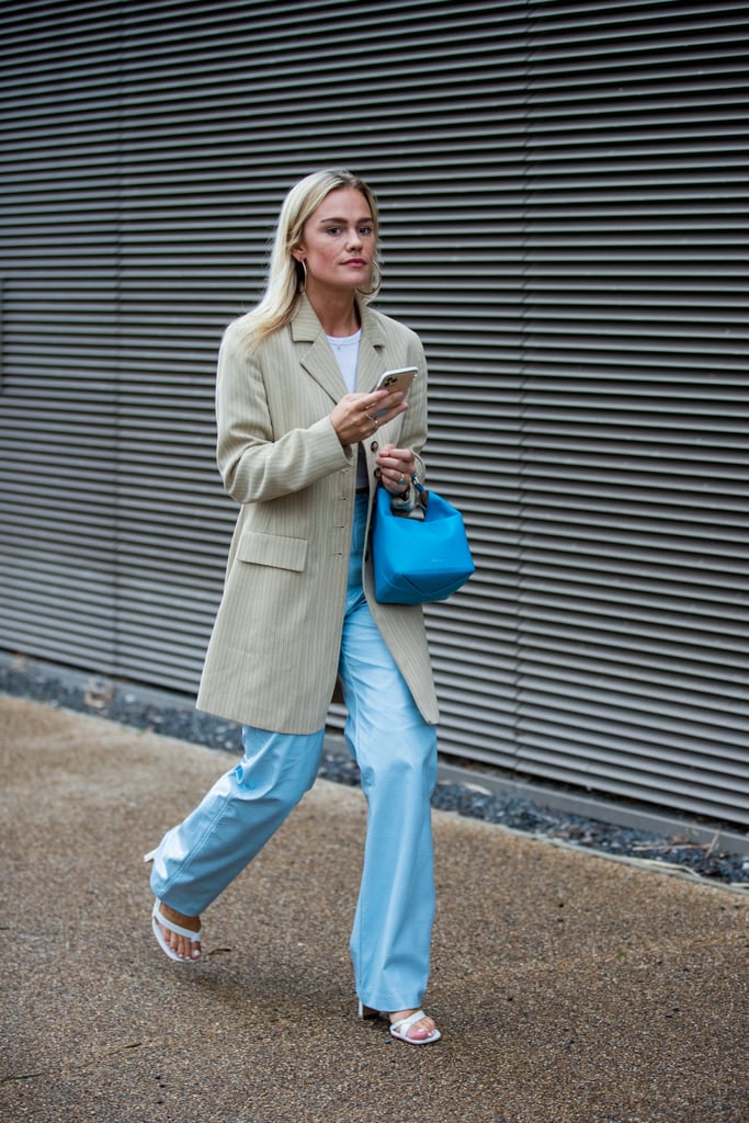 We love the addition of the punchy robin's egg blue bag to punch up the faded denim and neutral jacket combo.