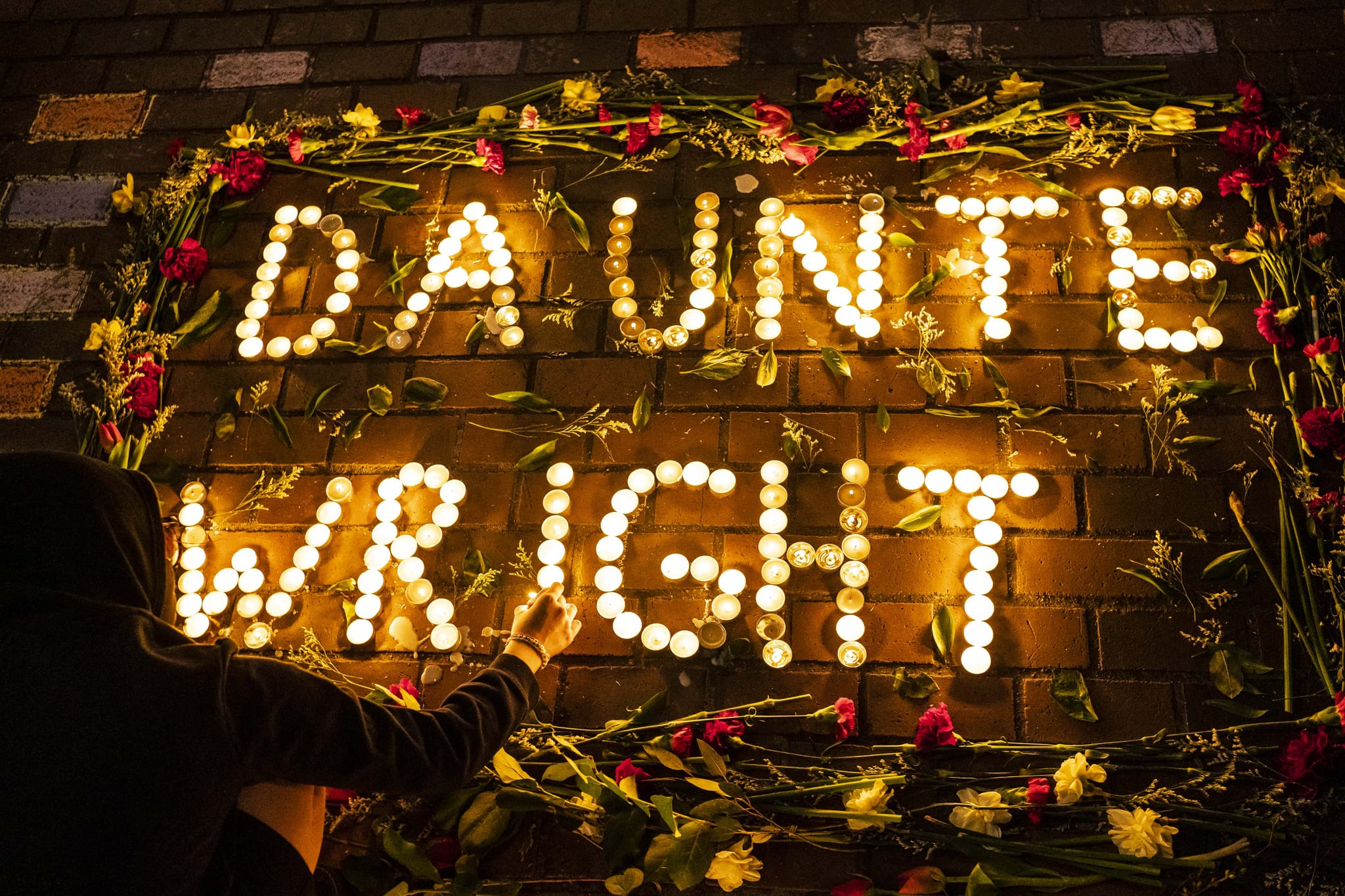 SEATTLE, WA - APRIL 12: A display of candles and flowers spells the name of Daunte Wright at a protest over his death on April 12, 2021 in Seattle, Washington. Wright, a Black man whose car was stopped in Brooklyn Centre, Minnesota on Sunday reportedly for an expired registration, and not far from where George Floyd was killed during an arrest in Minneapolis last May, was shot and killed by an officer who police say mistook her service revolver for a Taser.  (Photo by David Ryder/Getty Images)