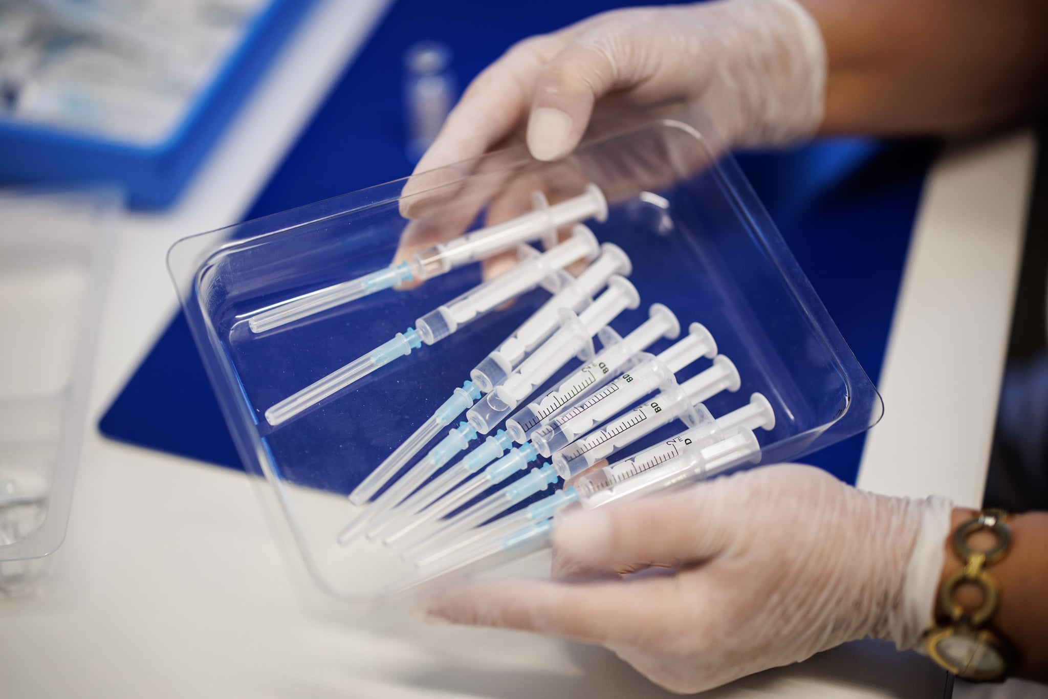 03 March 2022, Bavaria, Freising: A nurse holds a tray of syringes containing the vaccine Nuvaxovid from the manufacturer Novavax at the Freising Vaccination Center. Photo: Matthias Balk/dpa (Photo by Matthias Balk/picture alliance via Getty Images)