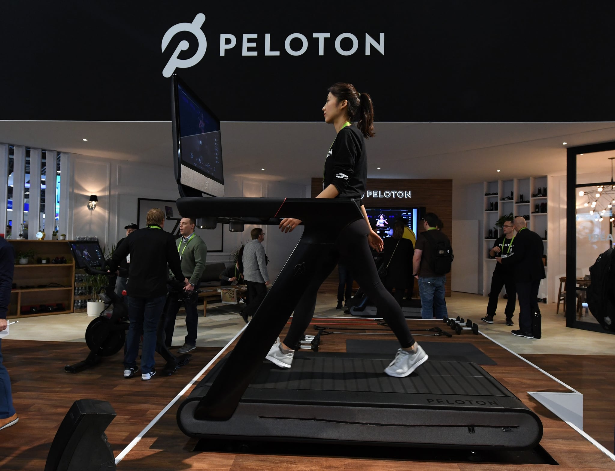 LAS VEGAS, NV - JANUARY 11:  Maggie Lu uses a Peloton Tread treadmill during CES 2018 at the Las Vegas Convention Center on January 11, 2018 in Las Vegas, Nevada. The USD 3,995 workout machine is expected to be available later this year and features a 32-inch touch screen that connects users to instructors giving live or on-demand fitness classes. CES, the world's largest annual consumer technology trade show, runs through January 12 and features about 3,900 exhibitors showing off their latest products and services to more than 170,000 attendees.  (Photo by Ethan Miller/Getty Images)