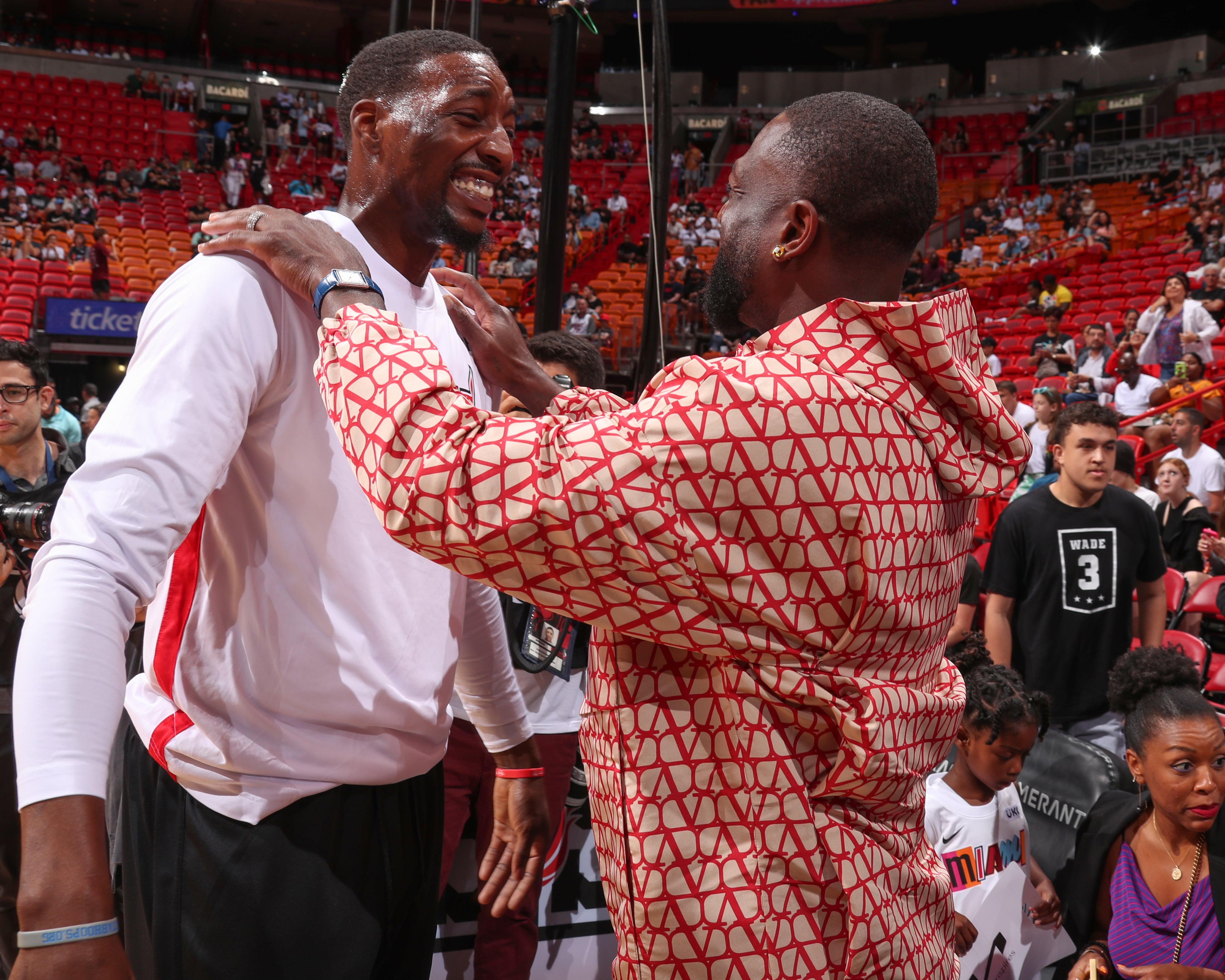 Dwyane Wade, Gabrielle Union, and Kaavia at Miami Heat Game