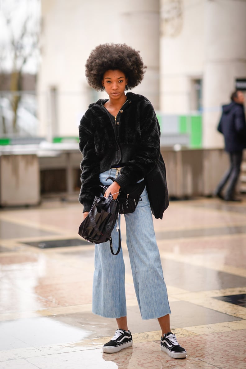 Wear Your Slashed Jeans With a Black Bucket Bag and Sneakers Instead of Sandals and a Clutch