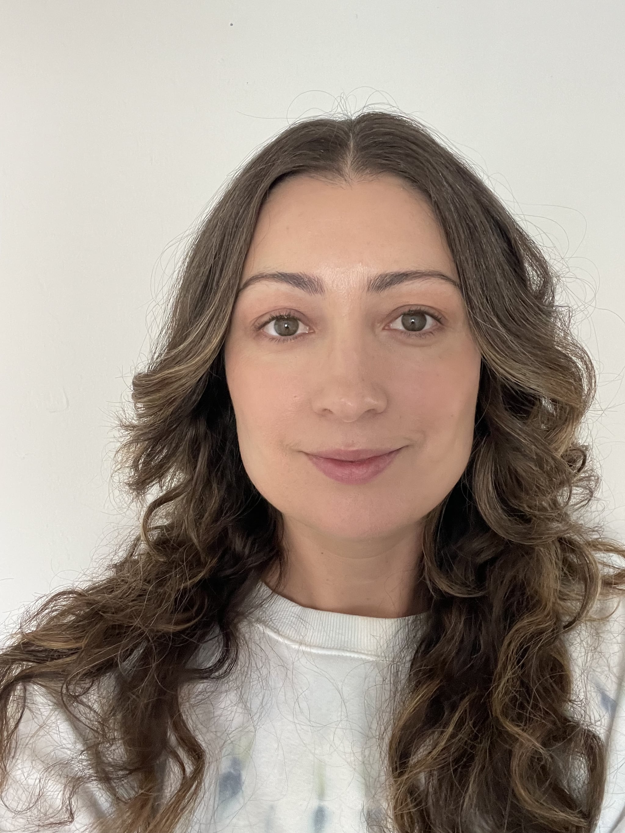 Woman's face after applying It Cosmetics CC+ Color Correcting Full Coverage Cream