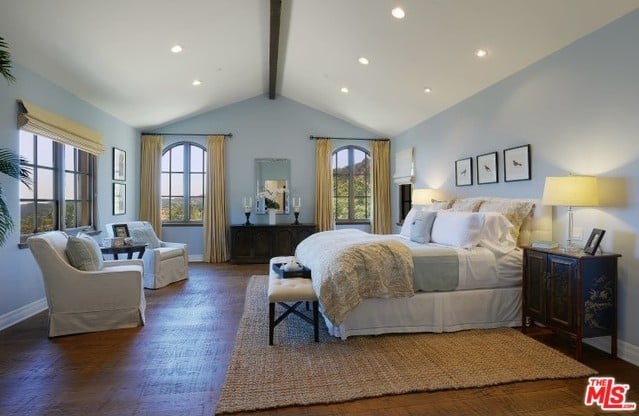 A vaulted ceiling is just one of the thoughtful details in this airy bedroom.