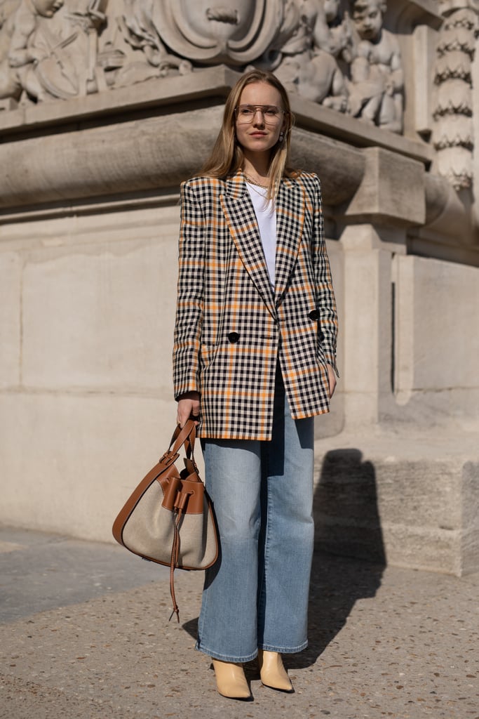 Business casual? How about cool-girl casual. The combo: wide-leg jeans, a punchy plaid blazer, t-shirt, smart bags, and heels.