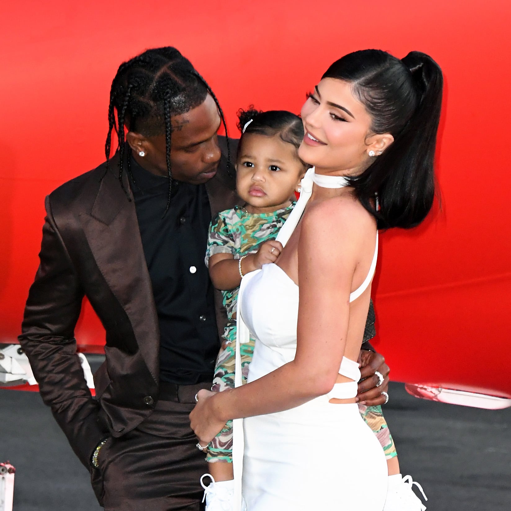 SANTA MONICA, CALIFORNIA - AUGUST 27: (L-R) Travis Scott, Stormi Webster, and Kylie Jenner attend the premiere of Netflix's 