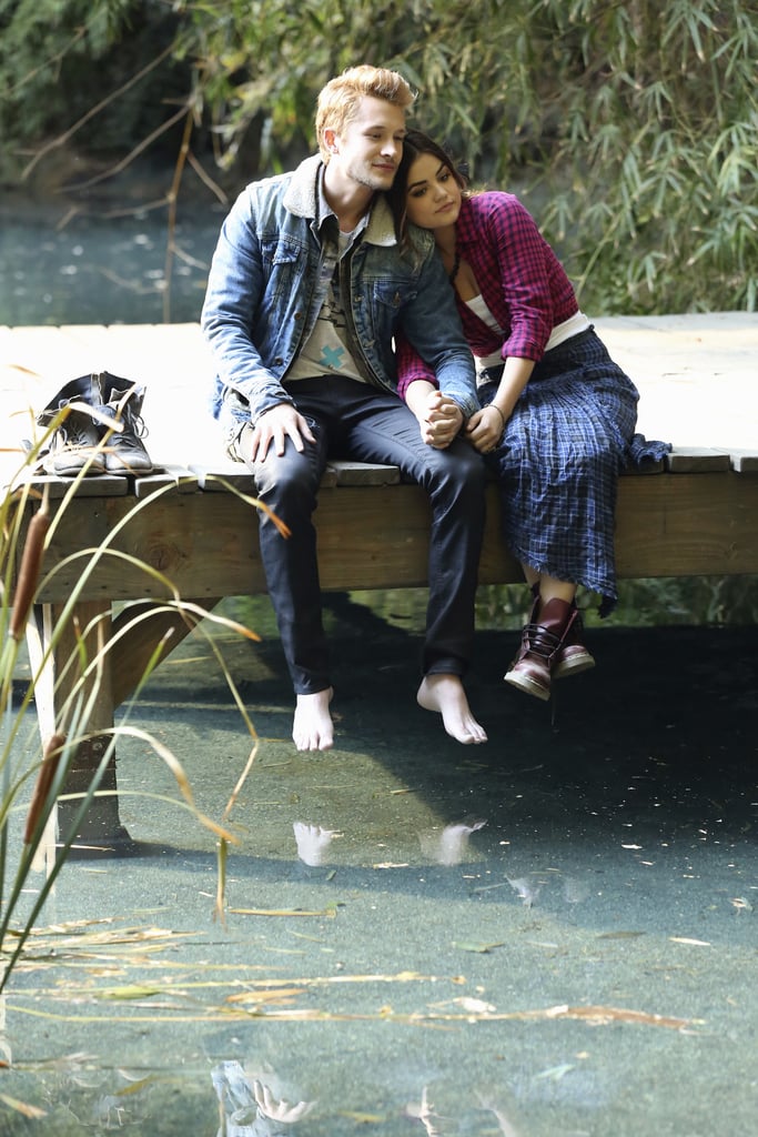 Aria and her new beau hold hands on a dock.
Source: ABC Family