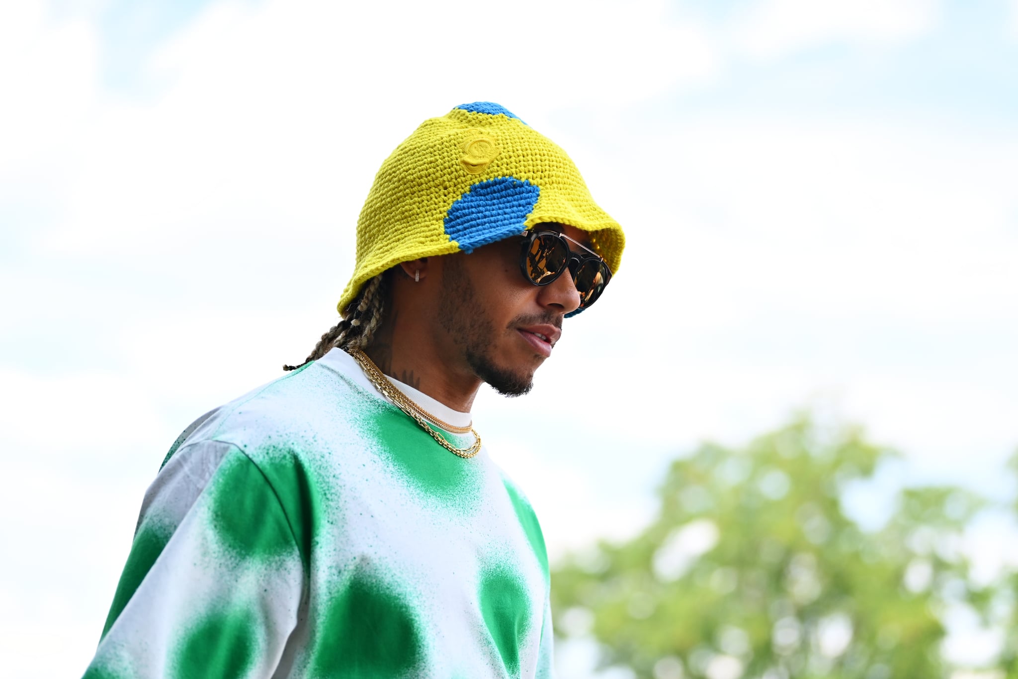 BUDAPEST, HUNGARY - JULY 28: Lewis Hamilton of Great Britain and Mercedes walks in the Paddock during previews ahead of the F1 Grand Prix of Hungary at Hungaroring on July 28, 2022 in Budapest, Hungary. (Photo by Dan Mullan/Getty Images)