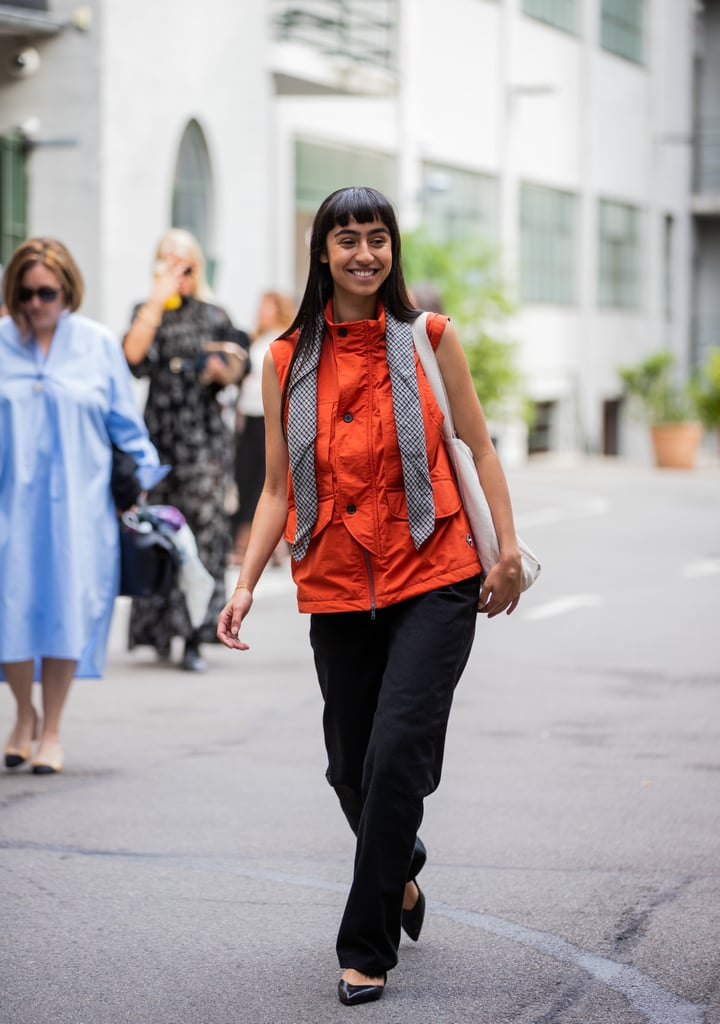 Outfit idea: Style a colorful parka vest with baggy denim or cargos and heels.