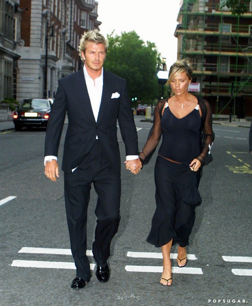 Victoria was pregnant with son Romeo in July 2002 as she and David attended the christening of Elizabeth Hurley's son in London.