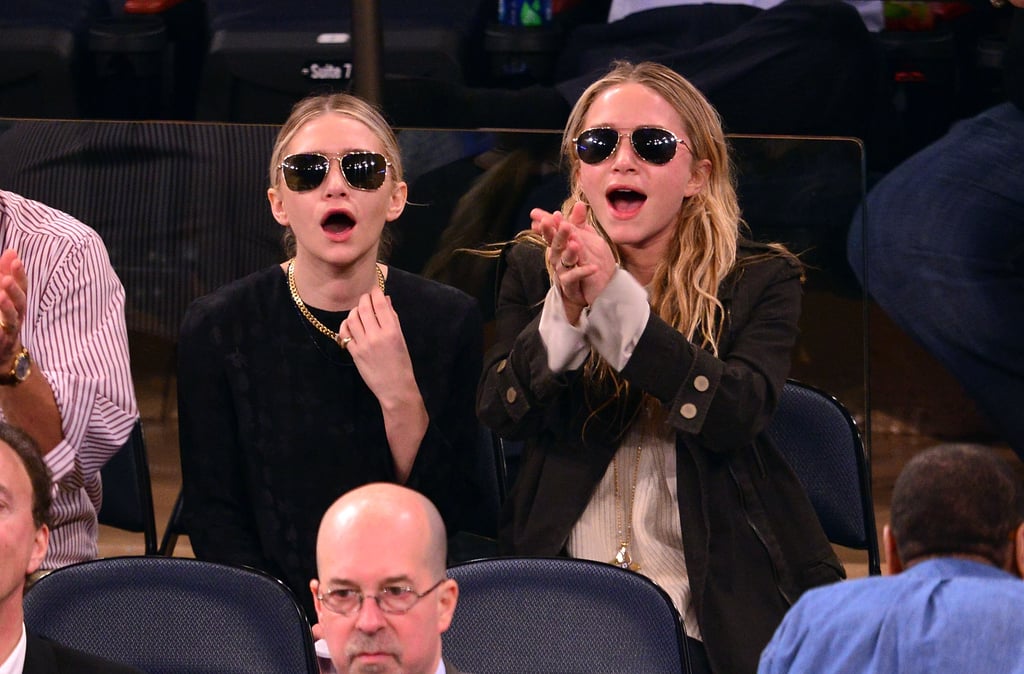 Ashley and Mary-Kate Olsen sported shades and smiles during a NY Knicks game in May 2013.