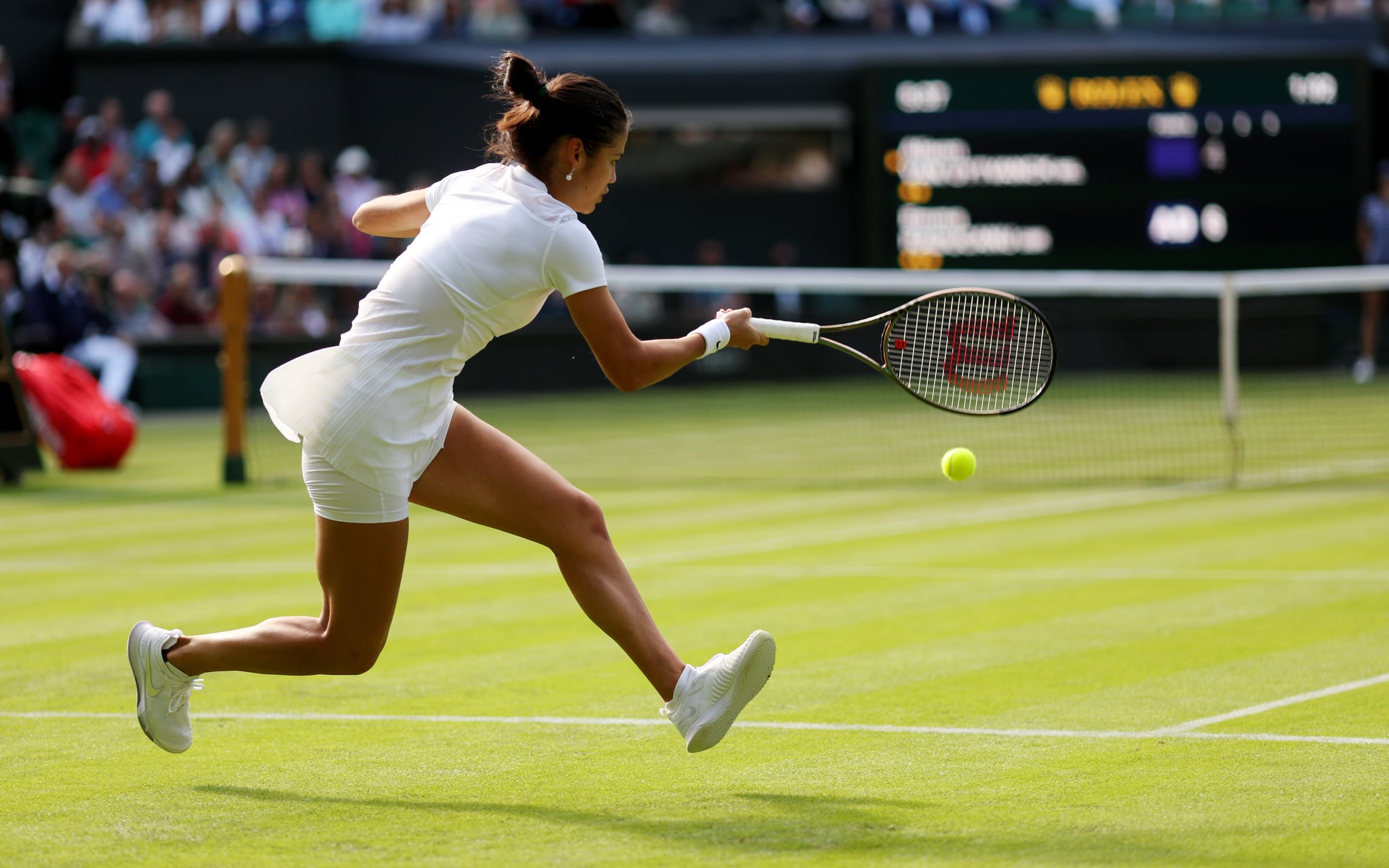 LONDON, ENGLAND - JUNE 27: Emma Raducanu of Great Britain plays a forehand against Alison Van Uytvanck of Belgium in the Women's Singles First Round match during Day One of The Championships Wimbledon 2022 at All England Lawn Tennis and Croquet Club on June 27, 2022 in London, England. (Photo by Julian Finney/Getty Images)