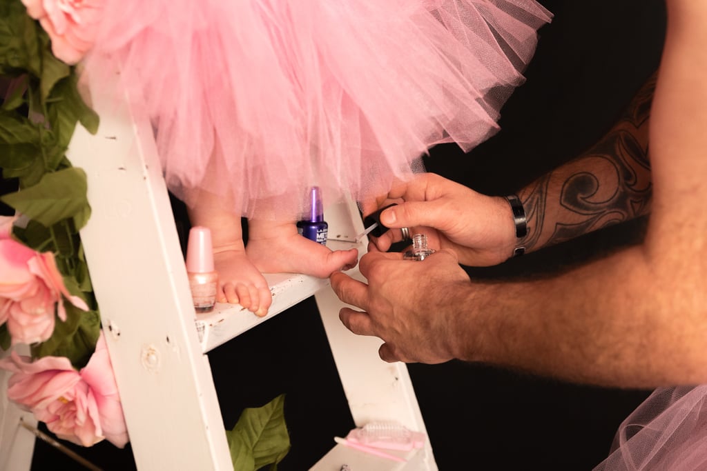 Dad and Baby Daughter Wear Matching Tutus For Photo Shoot