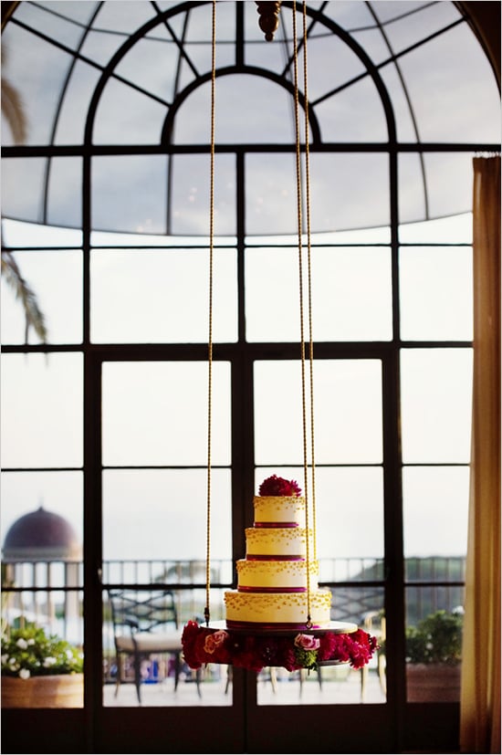 You may not have ever seen a hanging cake before, but this one's tiered shape and ribbon-like, beaded texture is familiar in the best way possible.
Photo by Chenin Boutwell via Wedding Chicks You may not have ever seen a hanging cake before, but this one's tiered shape and ribbon-like, beaded texture is familiar in the best way possible.
Photo by Chenin Boutwell via Wedding Chicks