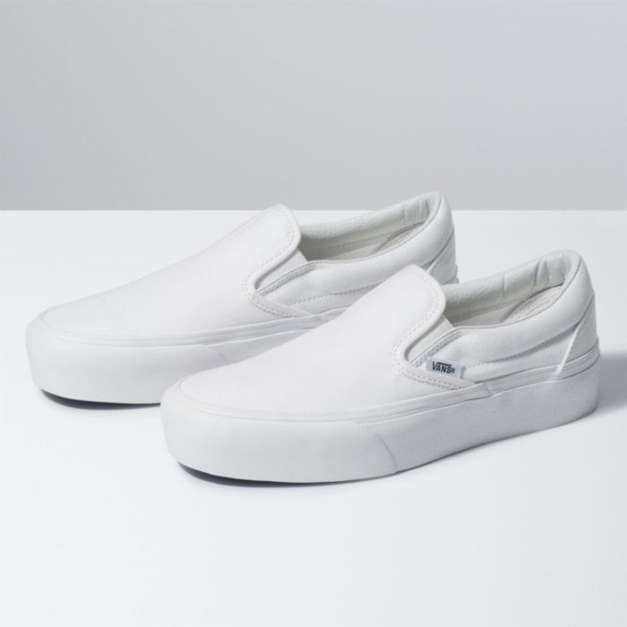 solid white vans slip ons