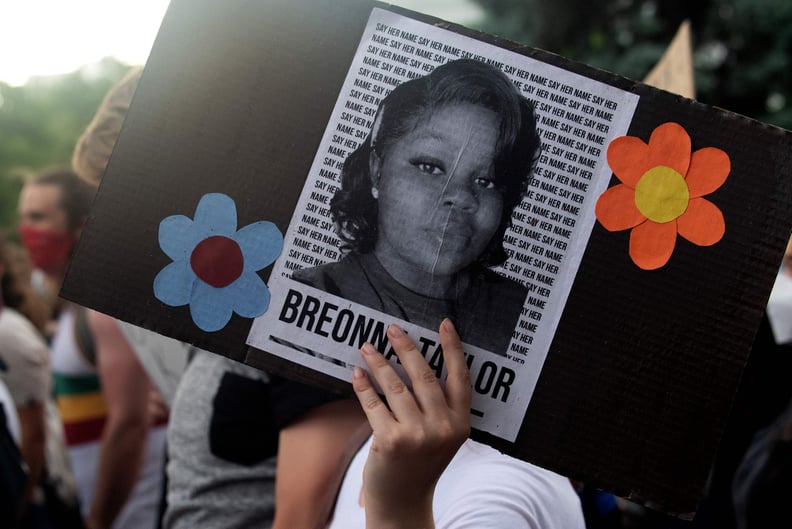 A demonstrator holds a sign with the image of Breonna Taylor, a black woman who was fatally shot by Louisville Metro Police Department officers, during a protest against the death George Floyd in Minneapolis, in Denver, Colorado on June 3, 2020. - US prot