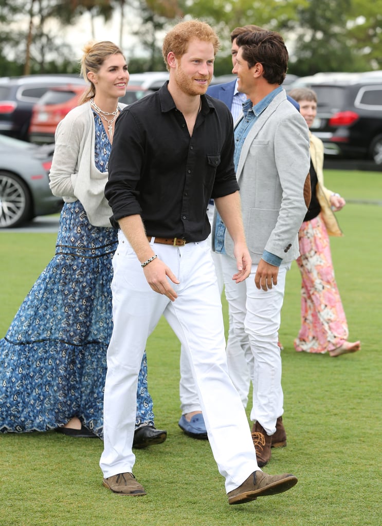 For a day at the polo, the prince wore a black shirt and white trousers.