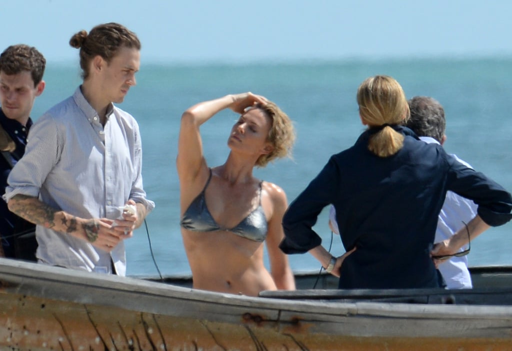 Charlize Theron struck sexy poses throughout her bikini photo shoot in Key West, FL.