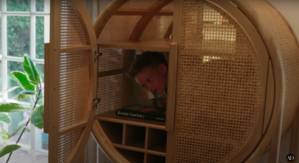 You'll catch a glimpse of Hilary's 8-year-old son Luca during the tour. Yes, he can fit in this rattan cabinet.