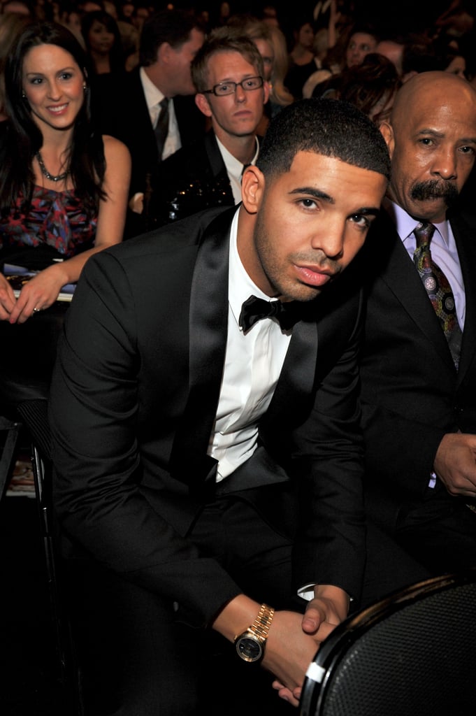 Drake looked dapper in his suit while sitting front row in 2012.