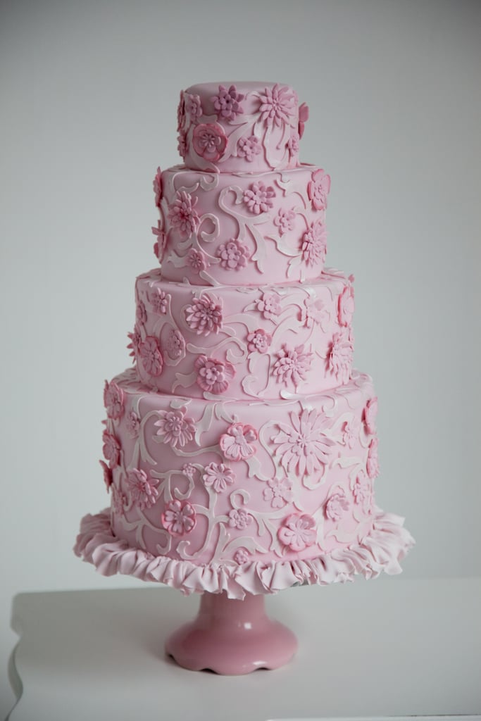 This cake, full of flowers, frills, and delicate details, has all the makings of a traditional cake — except it's all pink and was modeled after a Chanel dress.