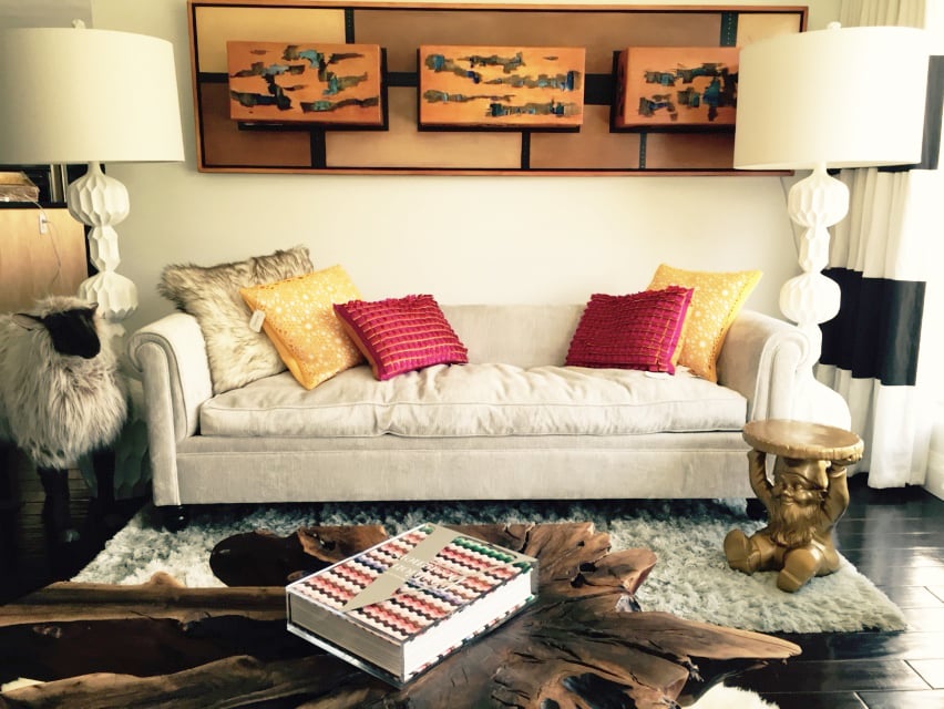 The living space is bookended by two white Beckett Lamps ($259).  David completed his sofa vignette with the addition of Reversible Throw Pillows ($79 each).