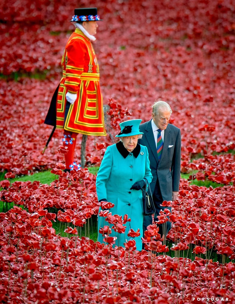 Queen Elizabeth II and Prince Philip, Duke of Edinburgh, visited the Blood Swept Lands and Seas of Red installation at the Tower of London on Thursday.