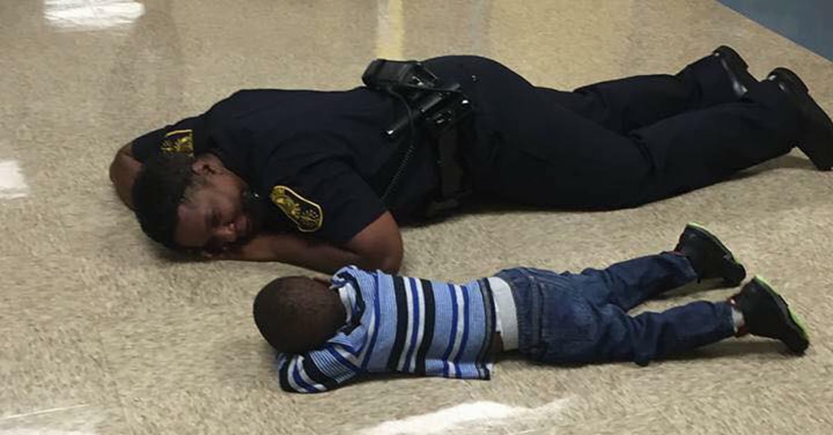 Photo of Police Officer Lying Down With Little Boy | PS Family