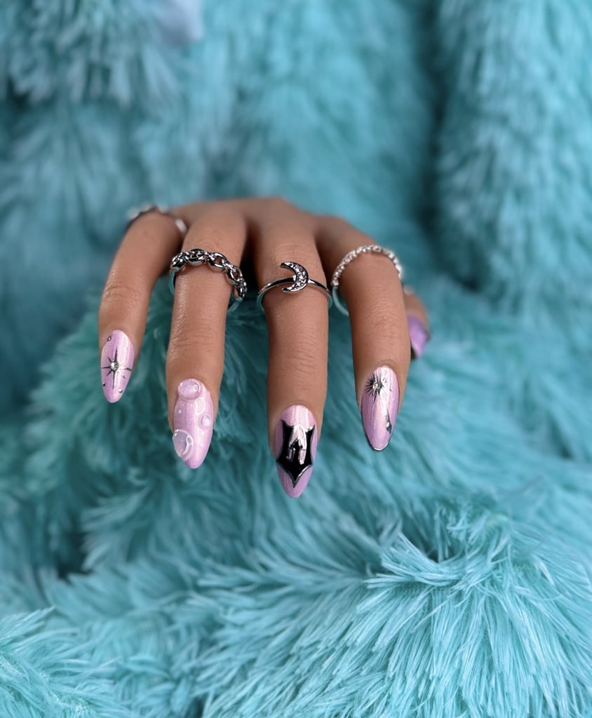 B.Clawed Elphie and GiGi "Wicked"-Inspired Press-on Nails ($46)
Wear your excitement for "Wicked: For Good" on your fingertips with these festive pink and green press-on nails. From the famed "W" logo to emblems like a wand and witch hat, this nail art will garner plenty of compliments at the movie theater and beyond.