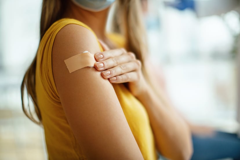 Young woman getting COVID vaccine booster