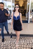 Anne Hathaway Wears a Mod Leather Minidress and Platforms at Cannes
