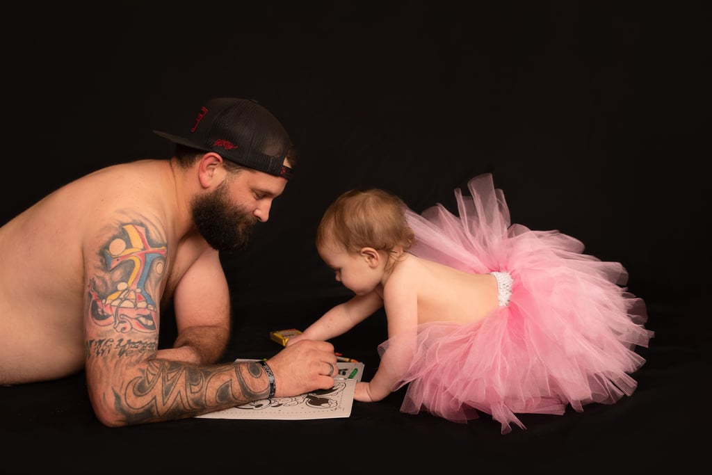 Dad and Baby Daughter Wear Matching Tutus For Photo Shoot