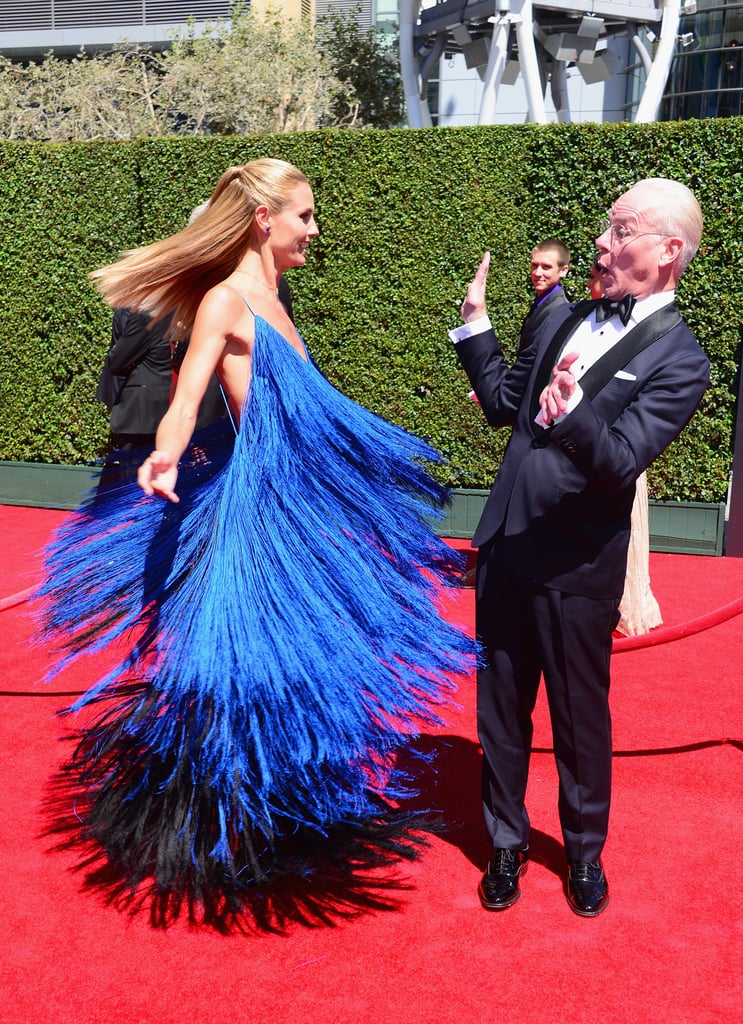 Heidi Klum took a spin in her detailed blue gown, which got a hilarious reaction from her Project Runway costar Tim Gunn.