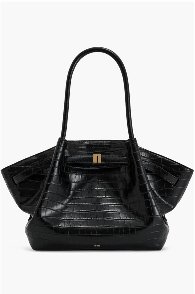 JW Pei Medium Hana Croc Embossed Faux Leather Tote ($149)
I like to have all my essentials nearby and easy to grab when I'm hosting, in case I need to make a quick run to the grocery store before the festivities begin. JW Pei's latest Hana tote is heavy on my radar. It's made from water-repellent, croc faux leather, which will make it ideal for various weather conditions. I also love its trapezoid-like shape, making it versatile to team with any outfit on the go.