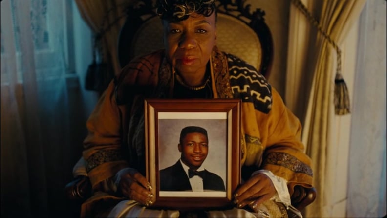 Gwen Carr holding a picture of Eric Garner