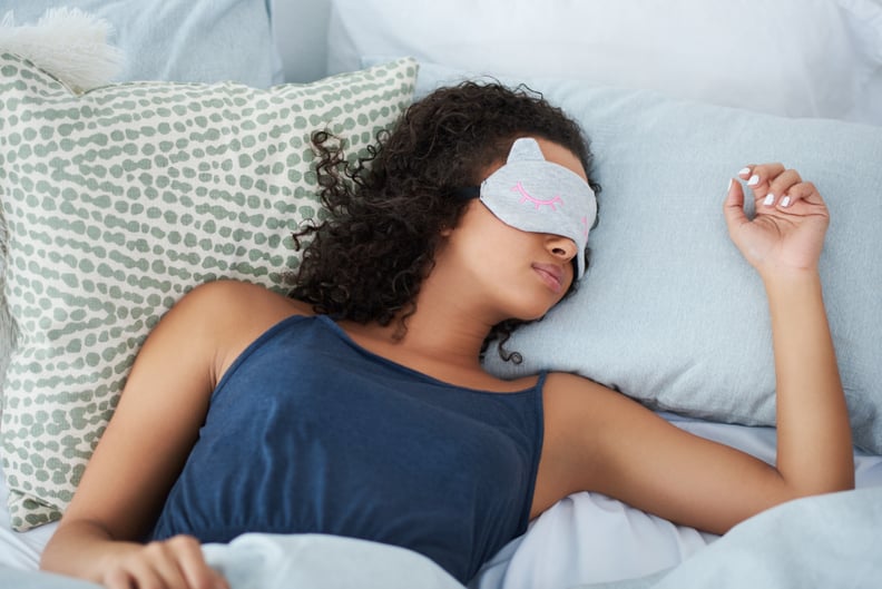 Shot of an attractive young woman sleeping in bed with an eye mask during the morning