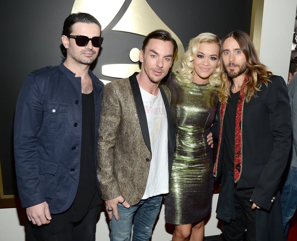 Jared, Shannon, and Tomo smiled with Rita Ora.