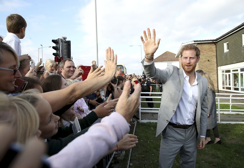 PEACEHAVEN, UNITED KINGDOM - OCTOBER 03:  Prince Harry, Duke of Sussex waves to locals on an official visit to the Joff Youth Centre in Peacehaven, Sussex on October 3, 2018 in Peacehaven, United Kingdom. The Duke and Duchess married on May 19th 2018 in W
