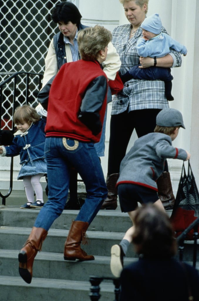 Making a case for the baseball jacket while on a school run with Prince Harry, Diana styled the look with denim jeans, featuring pocket detailing and brown boots.