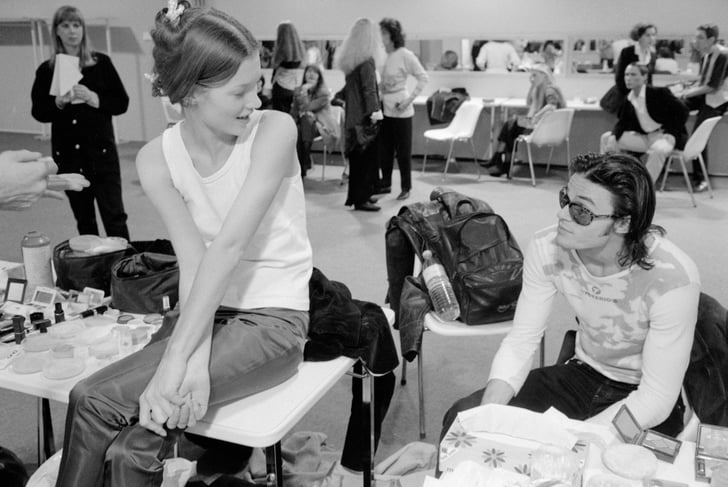 Backstage at Paris Fashion Week in 1991, wearing jeans and a white ...