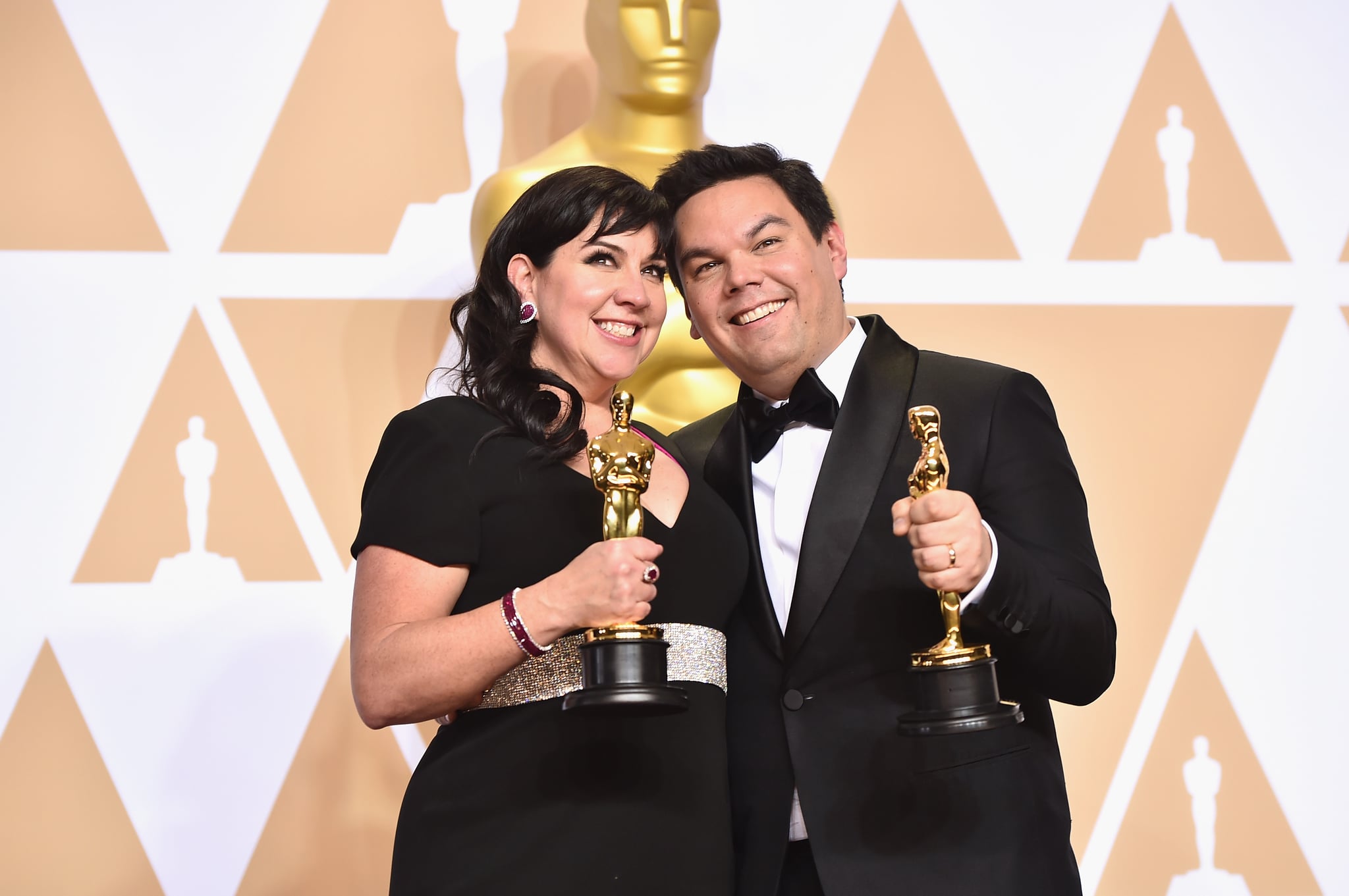 HOLLYWOOD, CA - MARCH 04:  Composers Kristen Anderson-Lopez (L) and Robert Lopez, winners of the Best Original Song award for 'Remember Me' from 'Coco,'  pose in the press room during the 90th Annual Academy Awards at Hollywood & Highland centre on March 4, 2018 in Hollywood, California.  (Photo by Alberto E. Rodriguez/Getty Images)