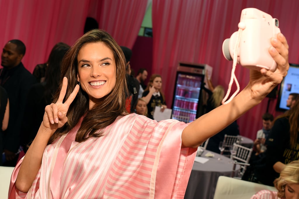 Peace! Alessandra Ambrosio takes a quick selfie backstage.