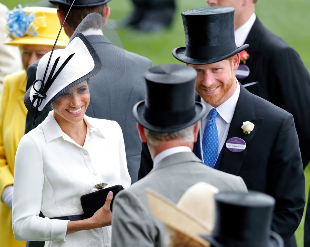 Meghan and Harry were all smiles while chatting with Prince Charles at the Royal Ascot in June 2018.