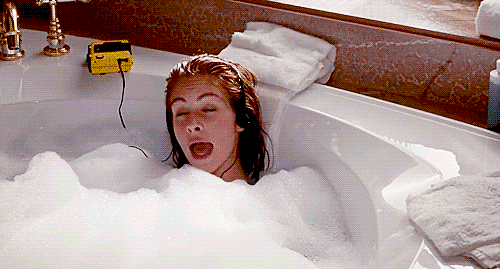 Taking a bubble bath.