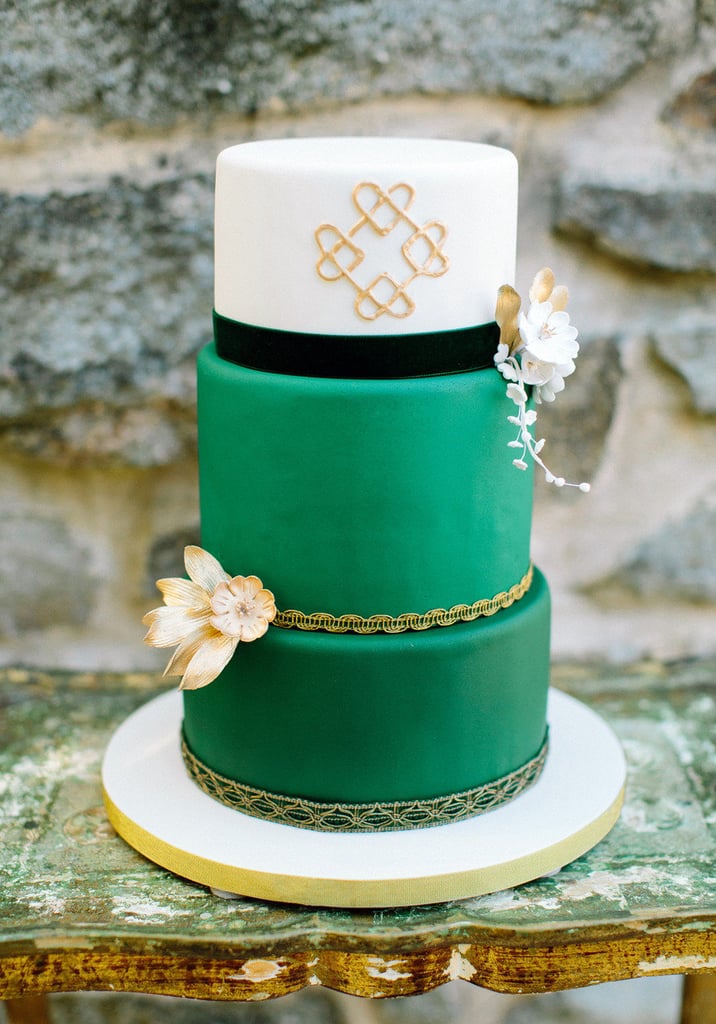 Sure, green is an unexpected color for a cake, but add gold hearts and gold ribbon, and it's as feminine as it gets. 
Photo by  Love by Serena via Style Me Pretty