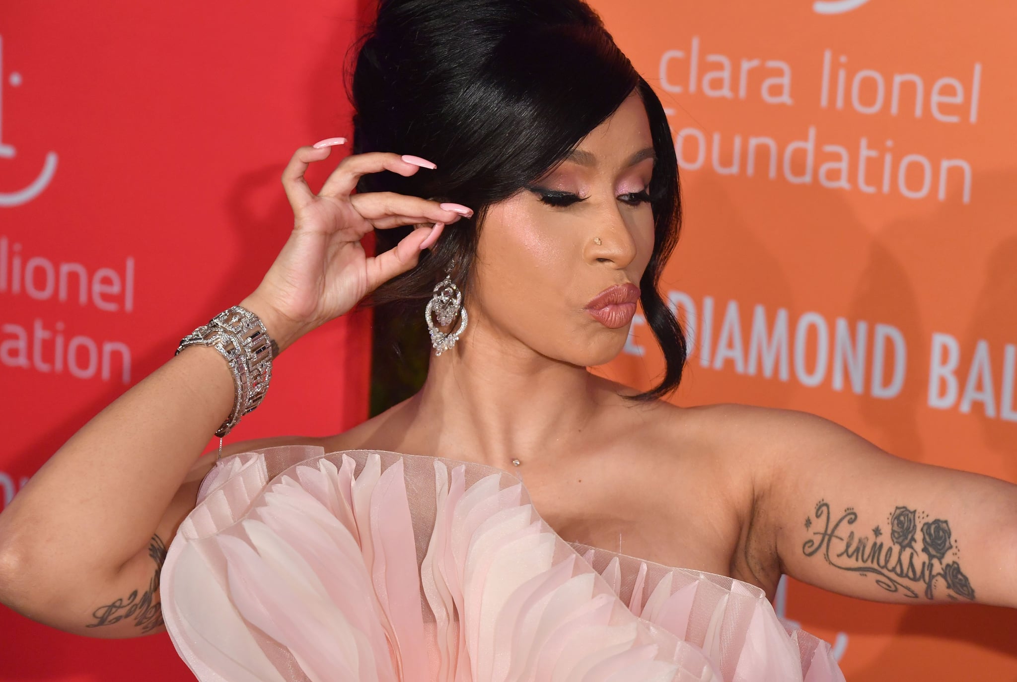 Cardi Bs Hennessy Arm Tattoo  Cardi Bs Face Tattoo Is a Tribute to Her  Son  POPSUGAR Beauty Photo 7