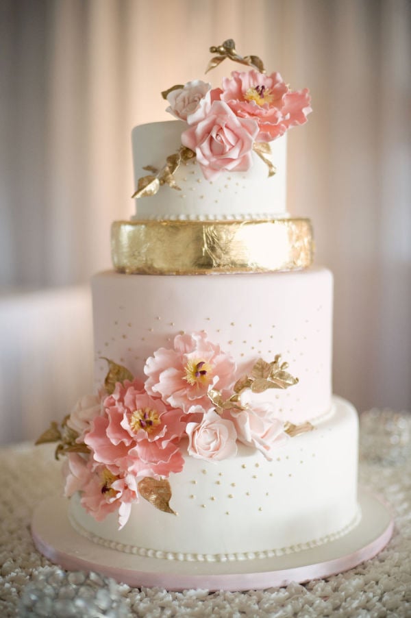 This beauty is practically blooming with pink petals and flecks of gold detail that are both timeless and tasteful.