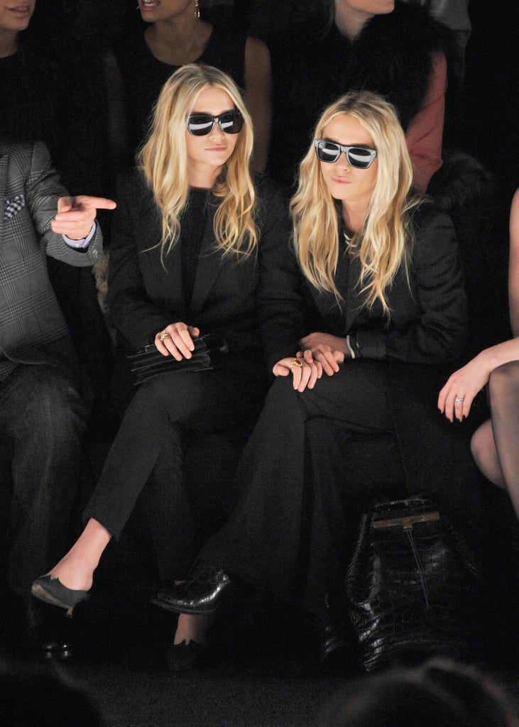 Twinning combo: If black is the color of power, then the Olsens were reigning queens at the J. Mendel show during Fall 2012 New York Fashion Week.

Ashley donned an all-black suit with retro shades.
Mary-Kate took inspiration from her twin working the exact same look.