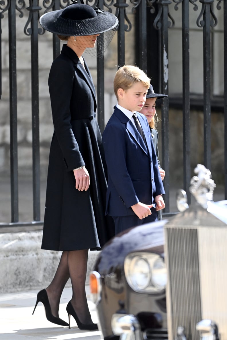 LONDON, ENGLAND - SEPTEMBER 19: Prince George of Wales, Catherine, Princess of Wales, Princess Charlotte of Wales during the State Funeral of Queen Elizabeth II at Westminster Abbey on September 19, 2022 in London, England.  Elizabeth Alexandra Mary Winds